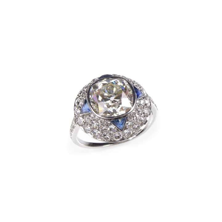Cushion cut diamond, sapphire and diamond dome cluster ring